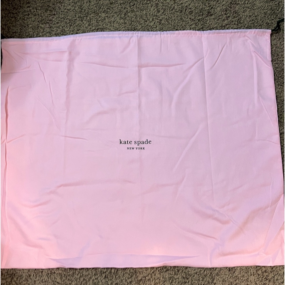 Kate Spade drawstring laundry bag pink with green Kate Spade logo on front